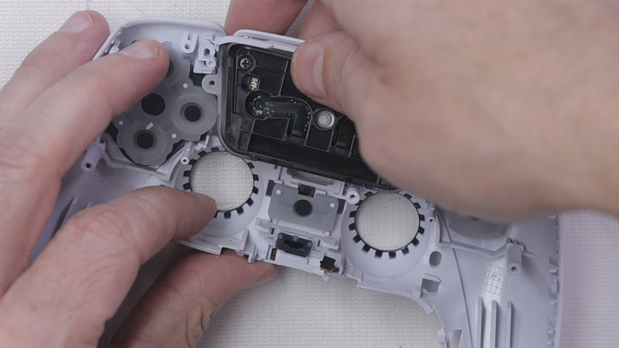 Step 12 - Push Up on Back of Touch Pad to Remove it