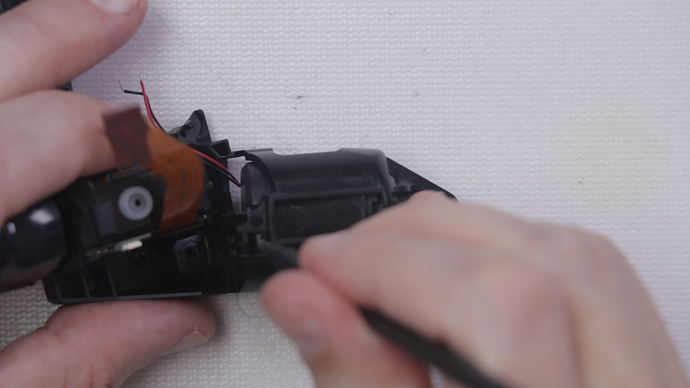 Step 13 - Push Down on Haptic Motor to Remove